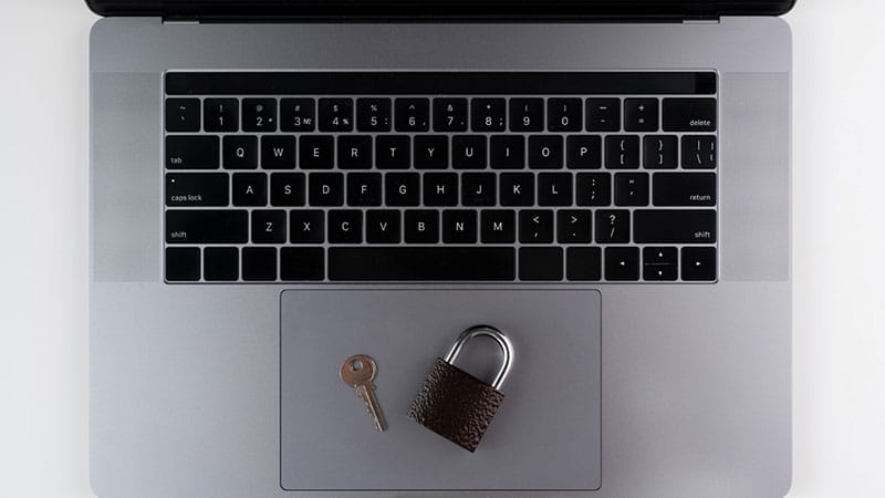 website-security Lock and key on laptop, representing website security