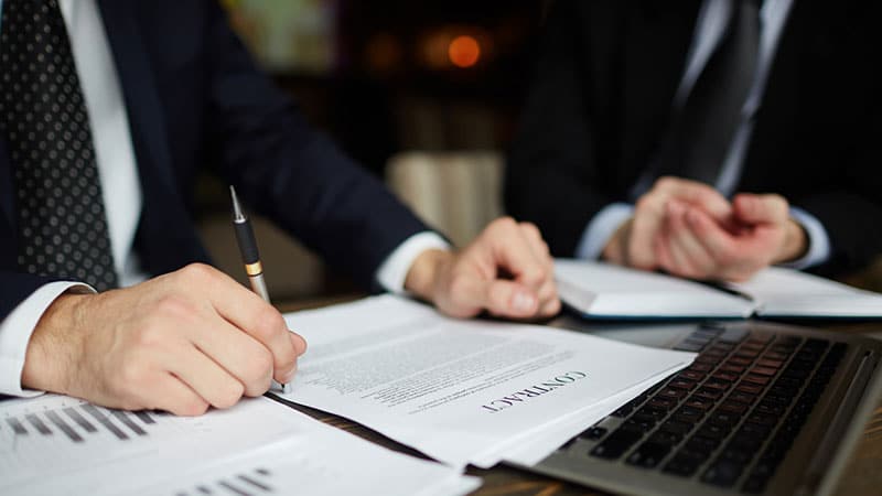 Lawyers dealing with paperwork